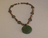 Magnesite with large green pendant