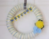 Striped White Yellow Blue Yarn Wreath With Yellow Peony Flower and Baby Blue Rosettes With Felt Welcome Bunting Banner. 12 Inches