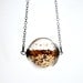 Copper glitter necklace in round hand blown glass necklace