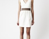 White Pout Dress - Vee-neck, waist gathers with a full skirt. Above knee.
