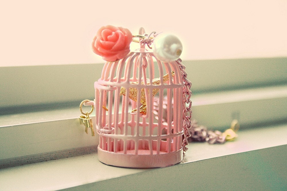 Golden bird inside pretty in pink cage necklace