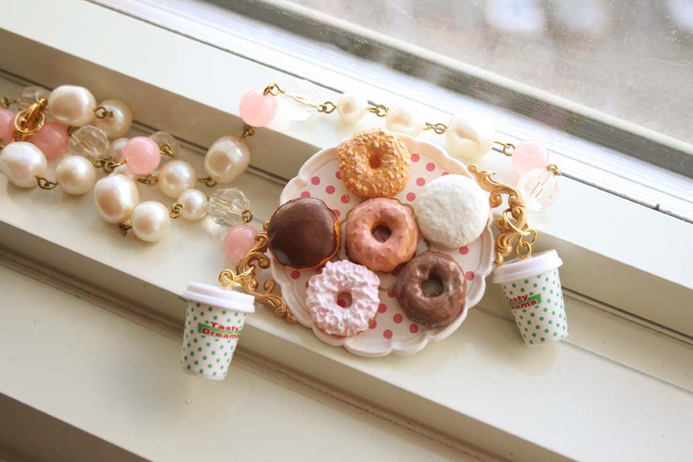 Doughnut on a tray with coffee necklace