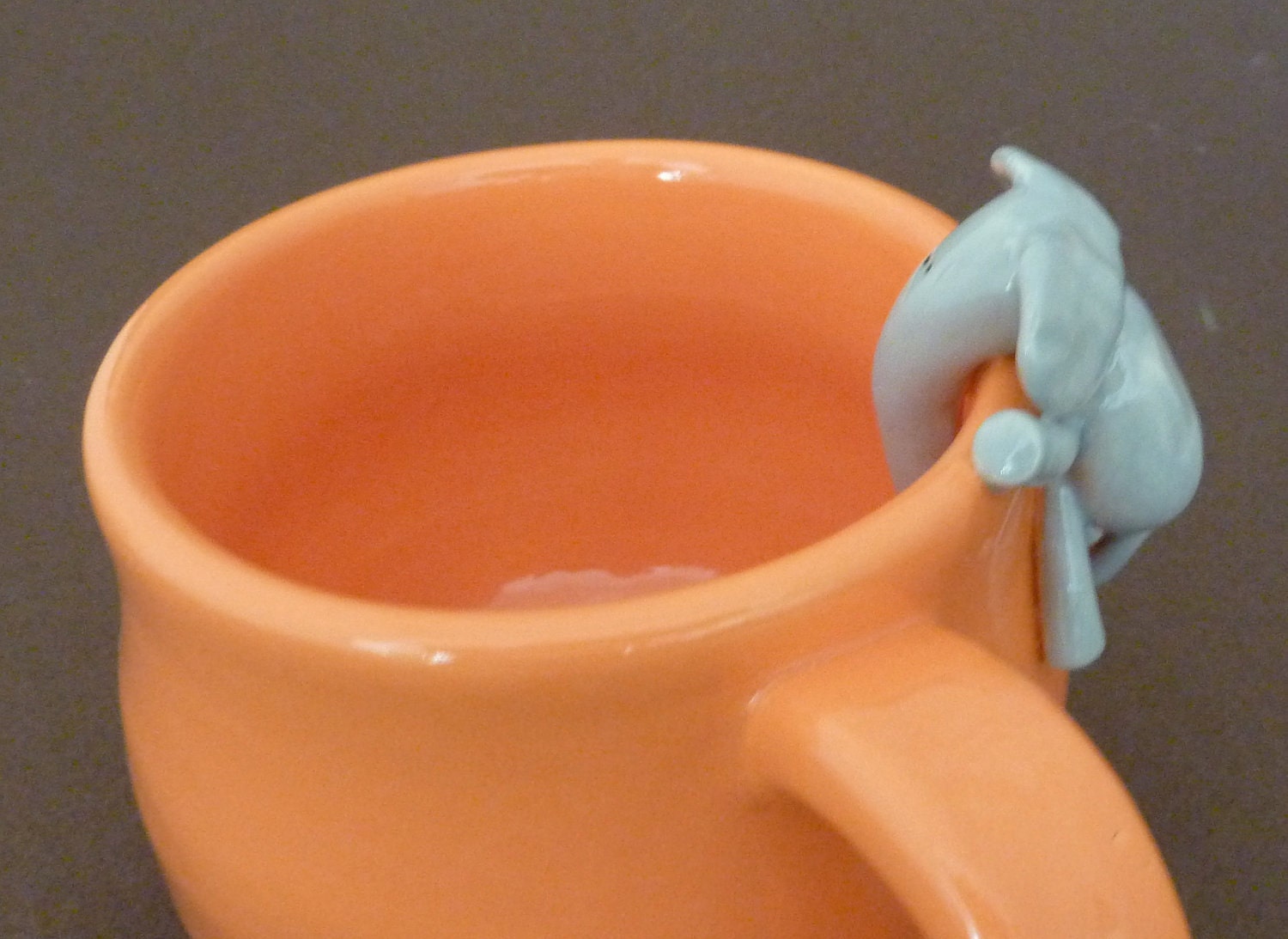Orange mug with elephant