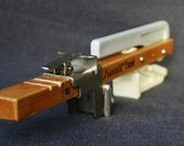 Open it. Fun vintage kitchen tool.