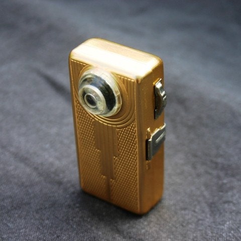 And there was light. Stunning mini antique golden flashlight.