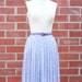 Vintage 70's lavender sheer pleated floral skirt by Campus Casuals with the original belt