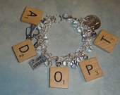 ADOPT  charm bracelet recycled scrabble tiles and clear crystal beads