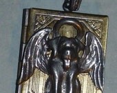 Memory locket with pewter dog angel  with brown cord