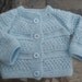 Blue sweater.