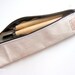 Canvas pencil case with brown zip, handprinted with happiness