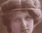 1912 Young Lady in Lilac with Bound Hair