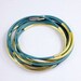 Teal leather bracelet threaded gold tube and magnetic clasp z440