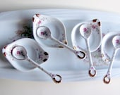 Tray with four small bowls and four condiment spoons with pink blossoms and 22kt gold