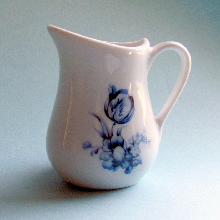 Small blue and white farmhouse style pitcher with Delft style flowers