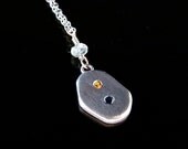 Fine silver Pendant with yellow topaz and blue sapphire