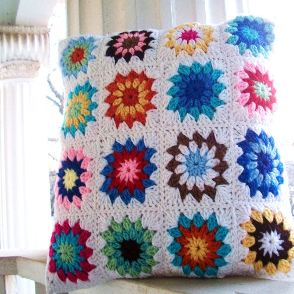 crocheted pillow sham with button closure measuring 17 inches square