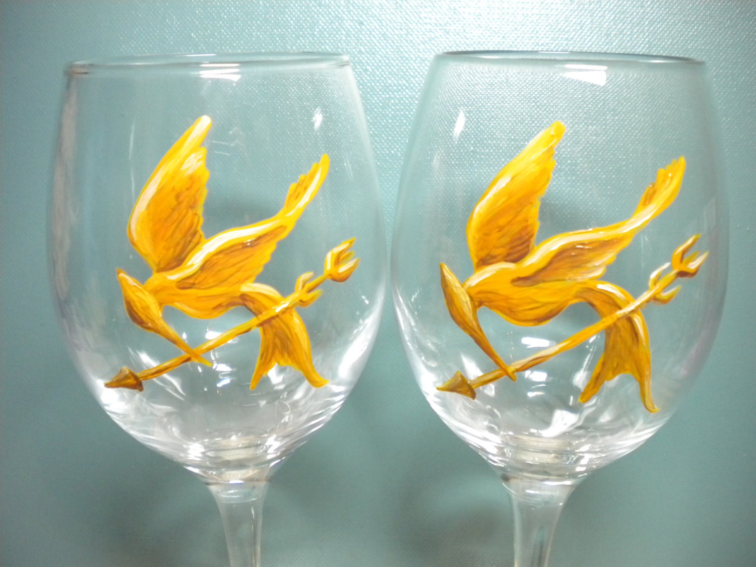 Katniss and Peeta Hunger Games Pair of Wine Glasses