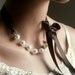 Pearl And Ribbon Necklace With Swarovski Crystal White Pearls And Chocolate Satin Ribbon 19 Inches ON VACATION