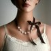 Pearl And Ribbon Necklace With Swarovski Crystal White Pearls And Chocolate Satin Ribbon 19 Inches ON VACATION
