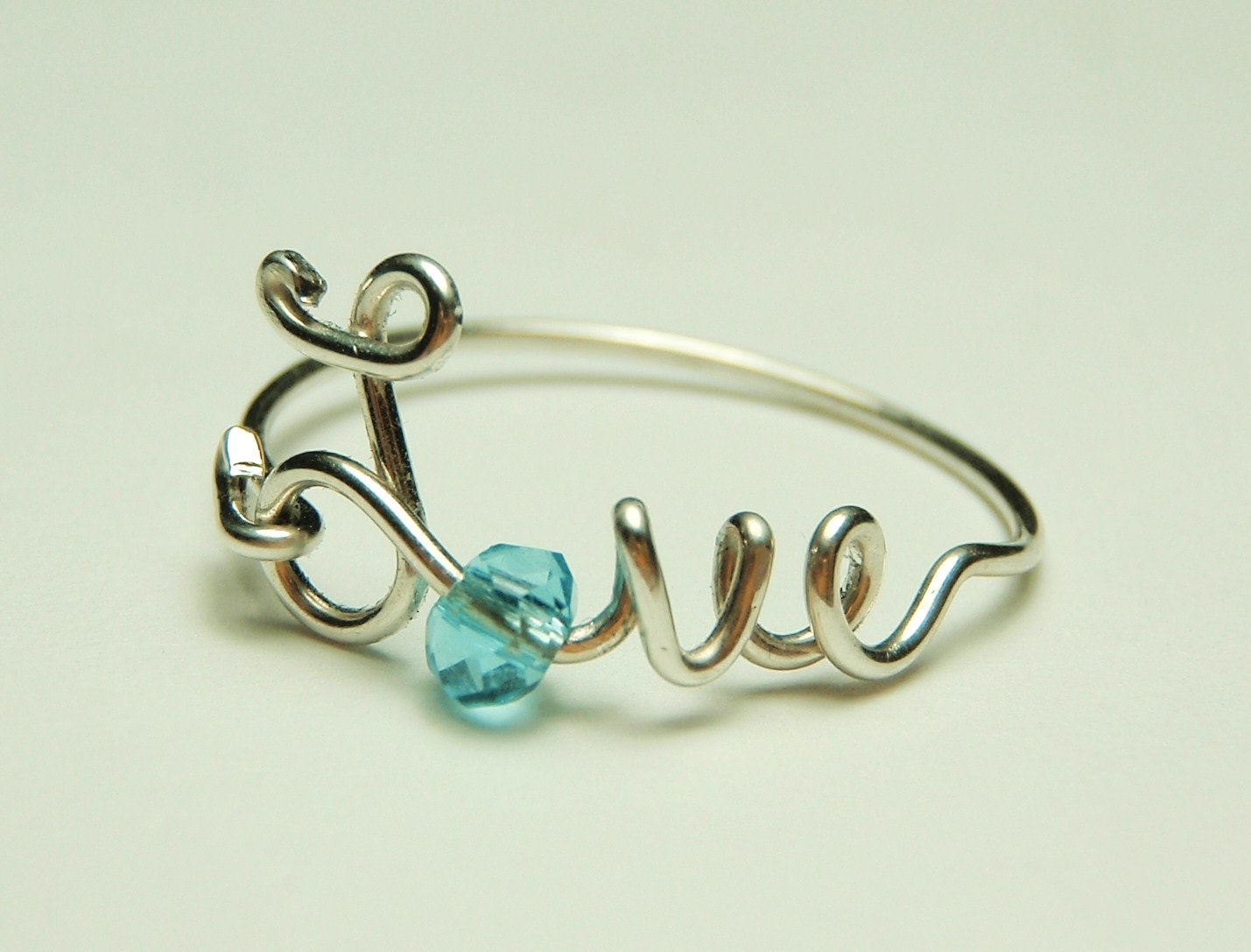love wire ring sterling silver - baby blue faceted crystal reduced price-love word- script-italics-writing