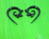 girl with dragon tattoo horn tribal earrings