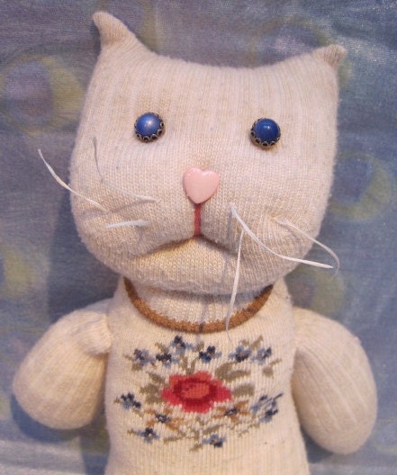 SOUR PUSS handmade upcycled sock toy, cream colored kitty cat with a bouquet at her breast