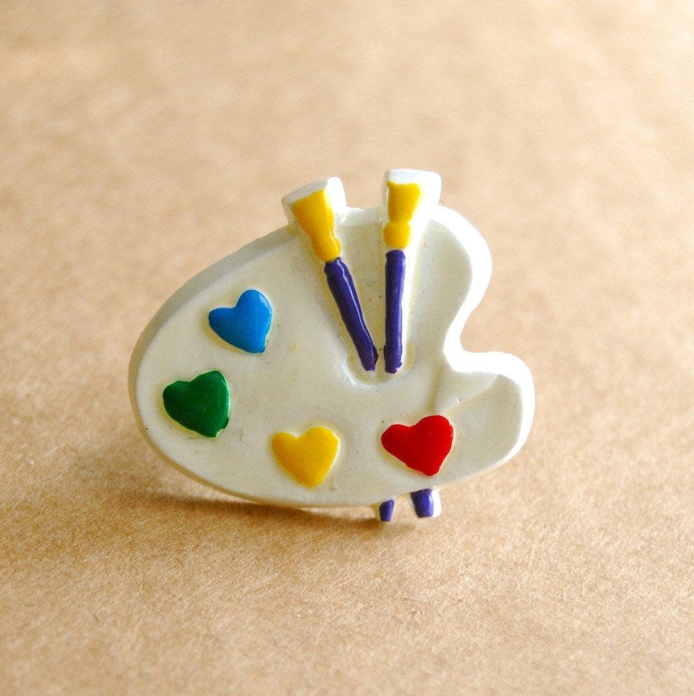 an artist's paint palette ring