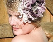 La Belle bridal birdcage veil with purple flower fascinator