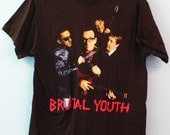 Vintage Elvis Costello T-Shirt in Excellent condition - great violent-ish graphic on front no stains, perfect rock and roll tee