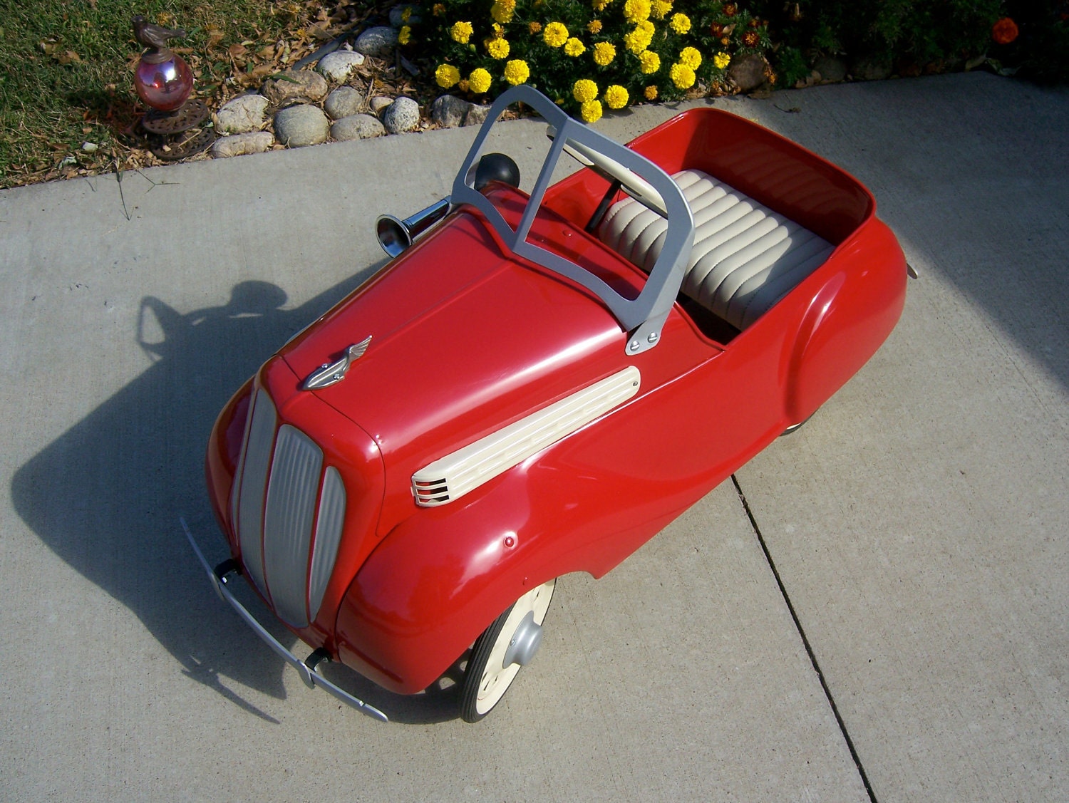 Vintage pedal car from mid to late 1930s in dazzling red now for sale. Original antique beautifully restored.