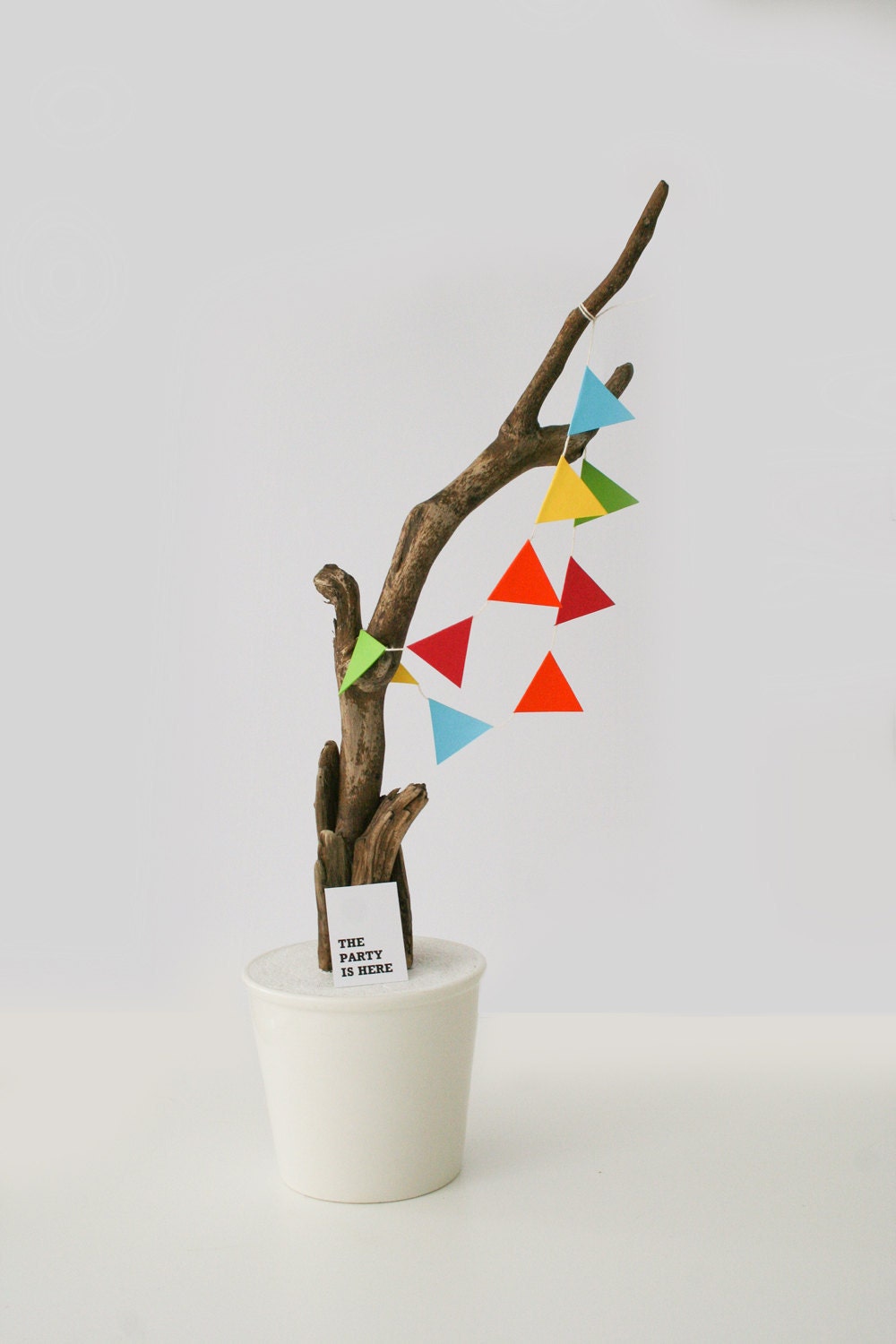 The party is here home decoration sculpture with natural wood and colourfull garland