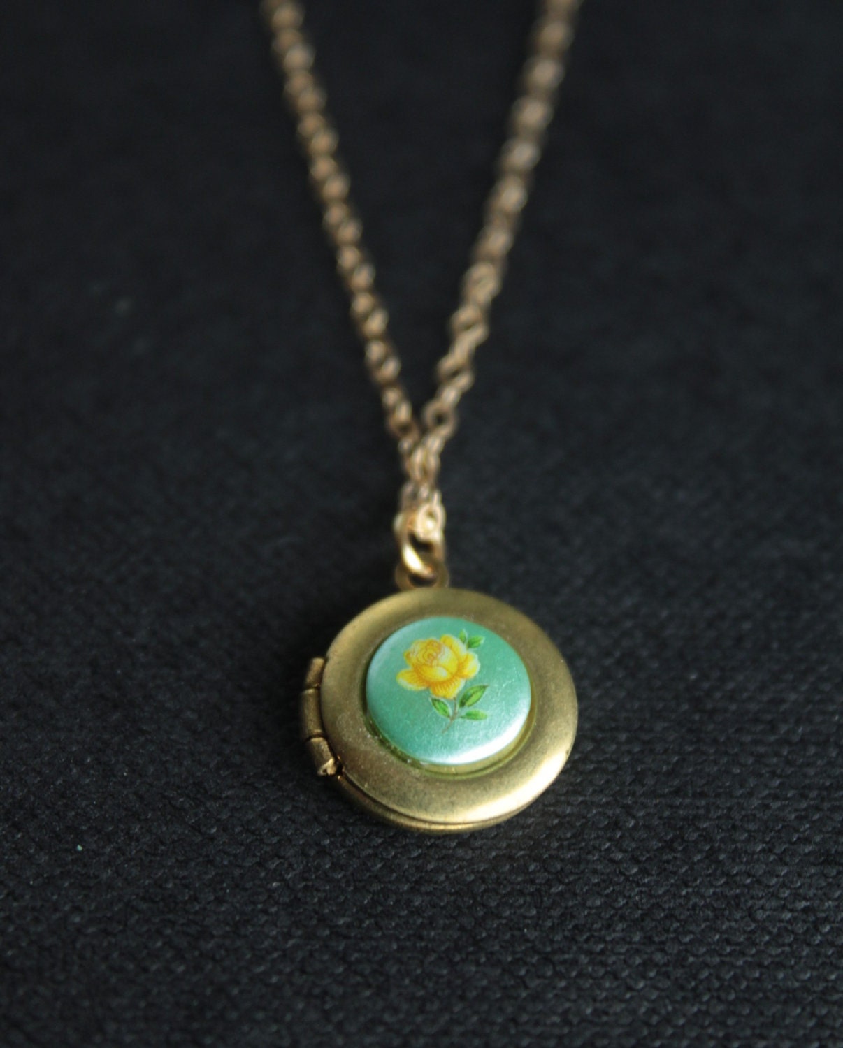 Little vintage locket with yellow rose