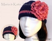 Blue crochet hat with pink trim and big crochet flower