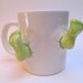 Mug with green feet