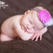 Magenta Rosette on a Dark Gray Skinny Headband. Infants, Toddlers, Teens and Adults. Perfect for Photography Props.