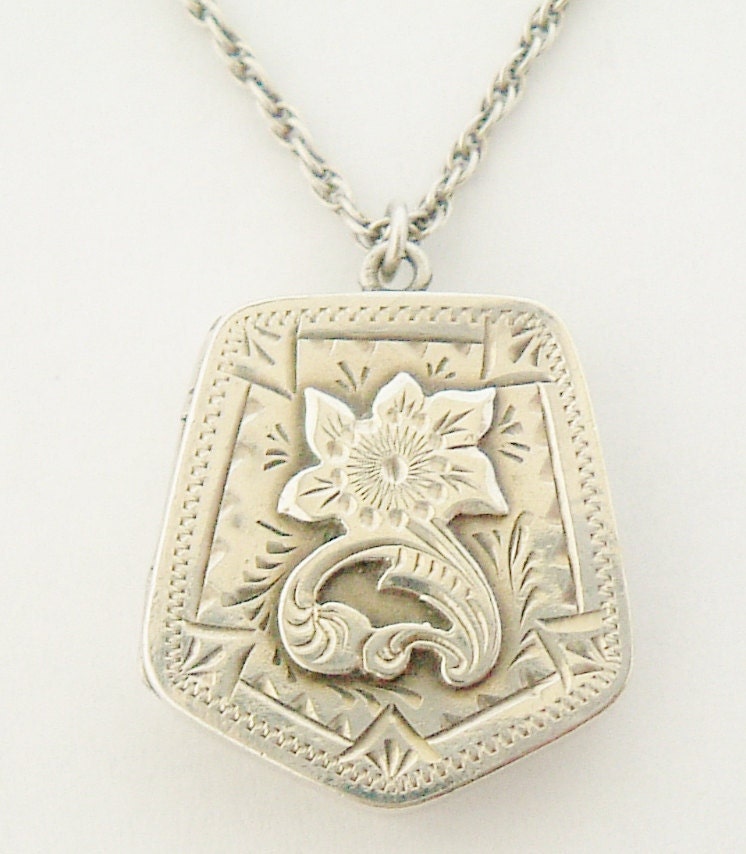 Victorian sterling silver locket and chain on 18 inch sterling chain.Hallmarked Birmingham 1900.