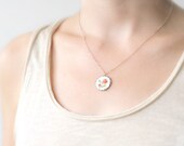 Tiny embroidered floral necklace with silver toned findings