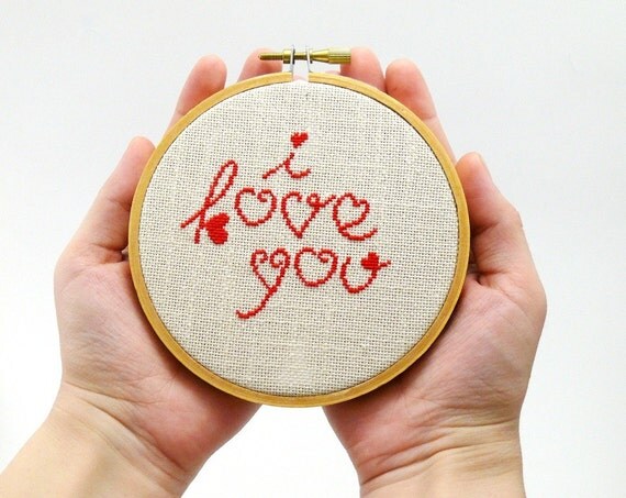Cross stitch in wooden hoop I love you in red color