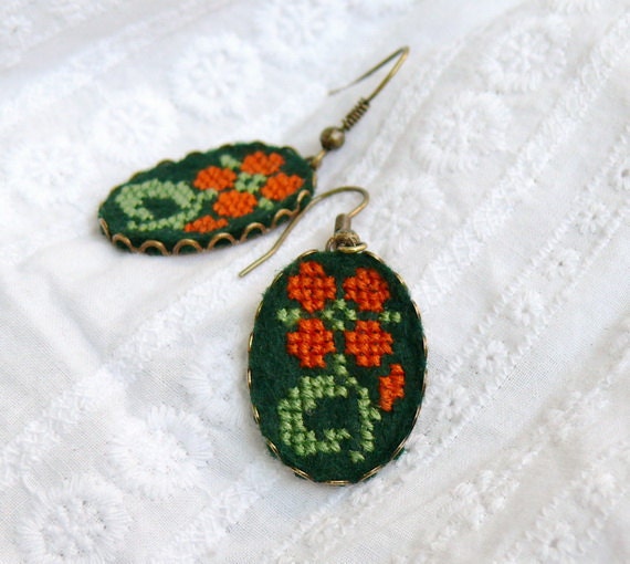 Cross stitched earrings with flower on dark green felt in bronze with hypoallergenic ear wires