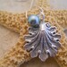Scallop shell necklace with Seafoam green glass pearl 18 inch silverplated chain Item 2000