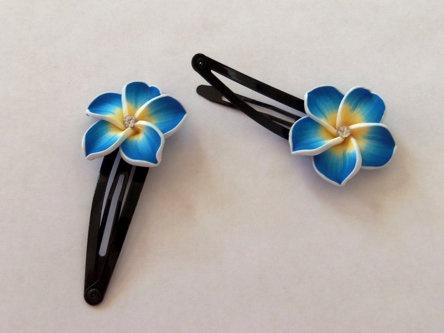 Blue and yellow flower barrettes