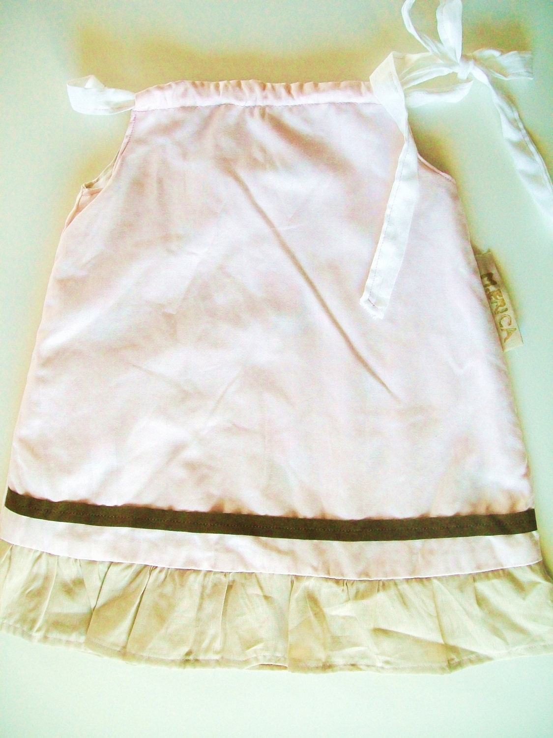 dainty pink baby/toddler pillowcase dress with chocolate brown grosgrain detail and linen ruffle