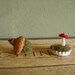 Felted red amanita mushroom in a white bottlecap