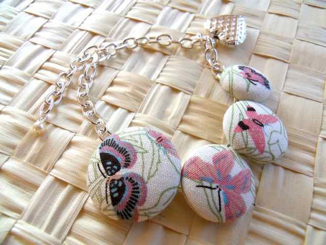Chain bracelet with fabric buttons and fortune locket