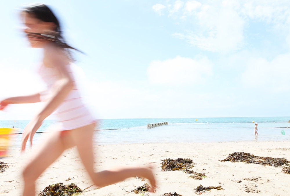 Girl running on Granville beach