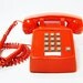 Vintage telephone tangerine orange push button phone with cord