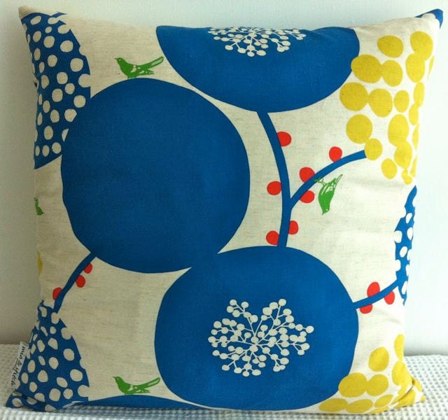 Japanese fabric cushion cover in natural background with blue circular floral motif, throw pillow, decorative cushion