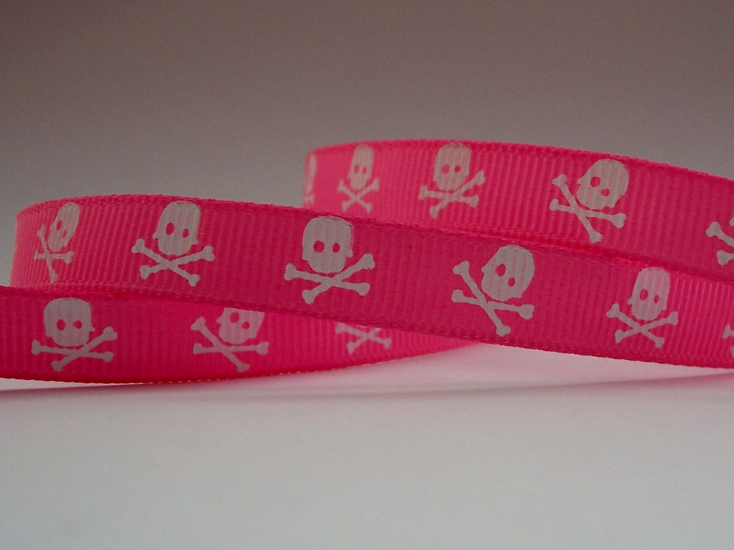 White Skulls on Pink 3/8 grosgrain ribbon-3 yds