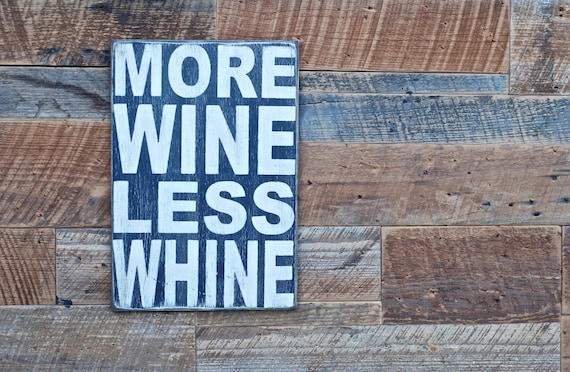 More wine less whine sign made from reclaimed plywood