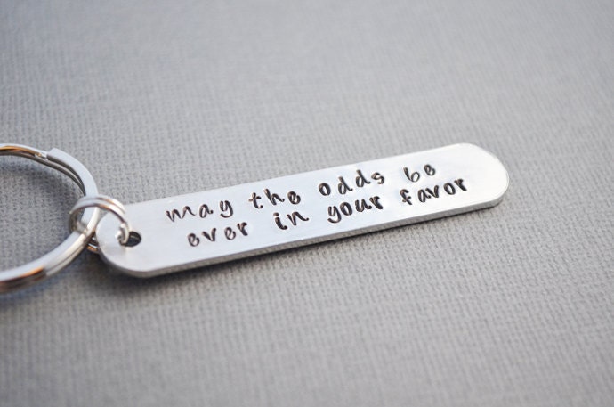 Hunger Games May the odds be EVER in your favor keychain hand stamped by TheCopperFox